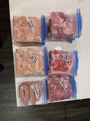 Our meat supplies! 18 bags of chicken, 7 bags of butterfly pork chops, 4 T-bone steak, 2 bags of brats, and 4 bags of pork tenderloin.