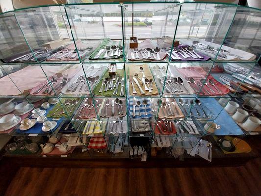 Assorted patterns of silverware, flatware, forks, knives, spoons, 
 on display and for sale