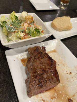 Steak and side salad with house bread