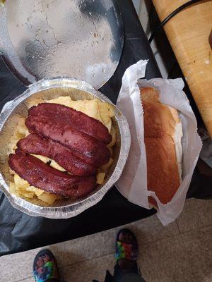 Beef sausage,  scramble eggs, home fries with a butter roll.