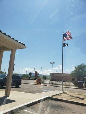 Flags outside of the post office and drive thru drop-off lane