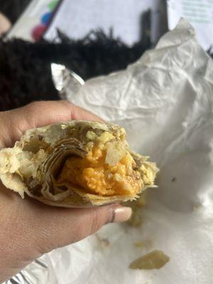 Not a great sausage breakfast burrito. Weird cheese clumpvery little sausage.