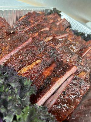 Ribs slow smoked over pecan and mesquite, until they're as tender as a mother's love.