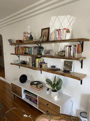 Wall-mounted 3 pieces of 8 ft hardwood shelves.