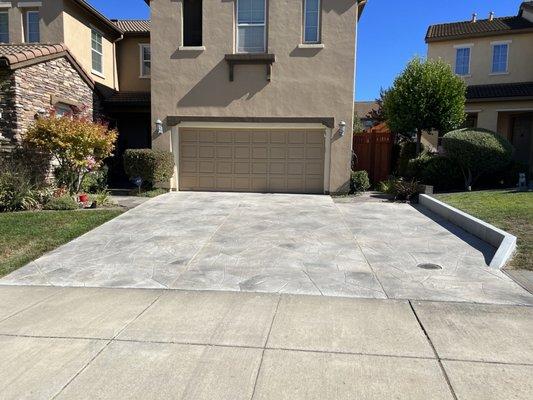 Original driveway with side extension both coated with an overlay and hand carved into a flagstone look with custom painted accents.