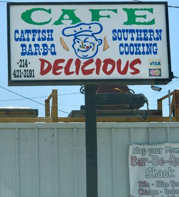 Cafe Delicious sign in parking lot