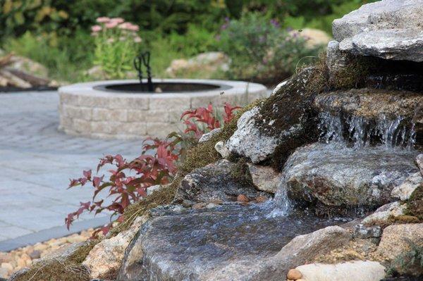 Natural stone spillway into swimming pool