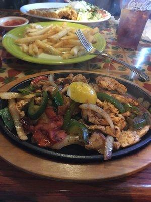 Cheese fries and chicken fijitas