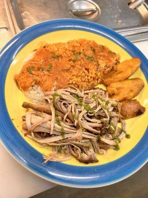 Pernil, white rice and beans with a side of Amarillo