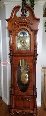 Front view of the grandfather clock - dent is on the side.