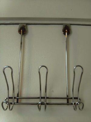 Very old clothes rack in a shower. One for all & everything. Use at your own risk.