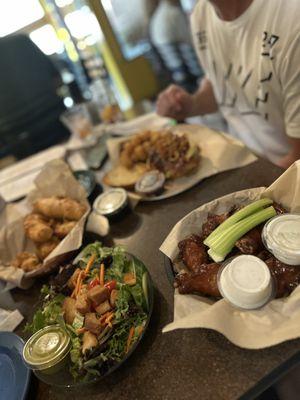 Texas burger, fried pickles, side salt with cilantro dressing, bourbon wings. Everything was delicious!