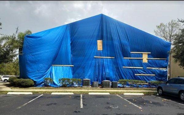 Building covered in tarp for 4 weeks.  No sunlight to tenants