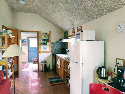 Kitchen with everything you would need including spices and condiments.