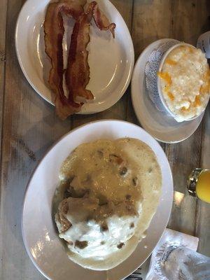 Biscuits and gravy, cheesy grits, and bacon