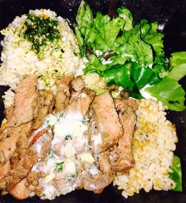 Steak plate with garlic butter, brown rice, and salad with blue cheese!