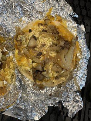 Potato, onion, egg and cheese  But I'm missing the steak in all 3 tacos