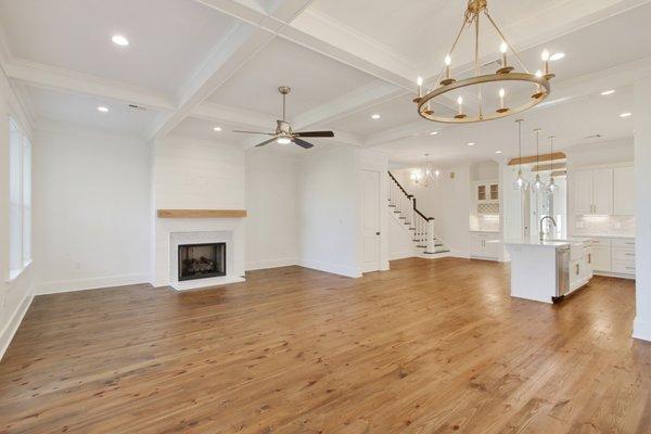 Coffered ceilings, fireplace w/marble hearth &cypress mantel w/real wood floors.