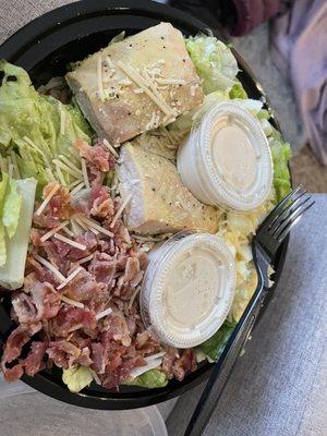 This is a Caesar salad with salmon! Look how gross the salmon looks - it looks like chicken and it is still frozen inside. Disgusting.