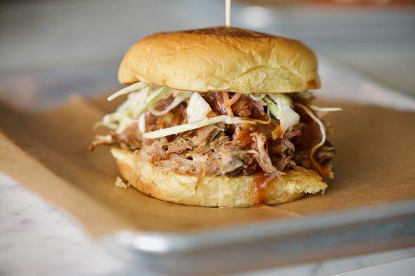 Pulled Pork Sandwich, Slaw, Onion Jam, Honey Bourbon Sauce