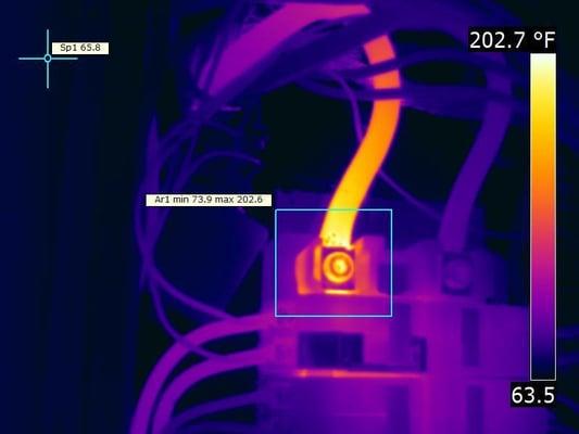 This is an image of a high resistance connection of a service cable and terminal lug on a 200 amp panel.