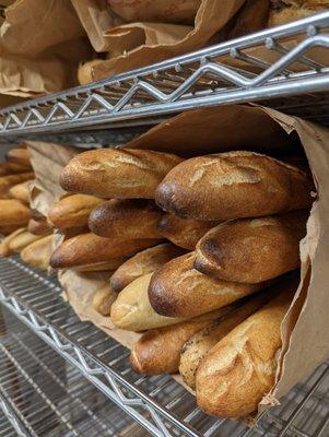 Fresh baguettes getting ready to come up from the bakery