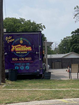 Truck with outdoor seating.