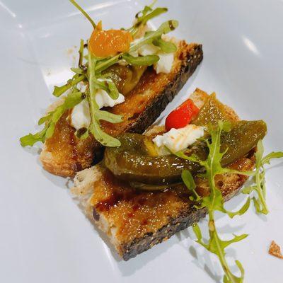 Grand opening night. Grilled bread with marinated peppers, goat cheese and arugula