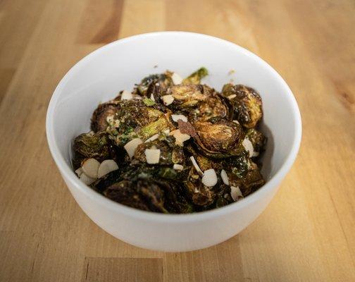 Charred brussel sprouts,  dijon mustard, almond garnish