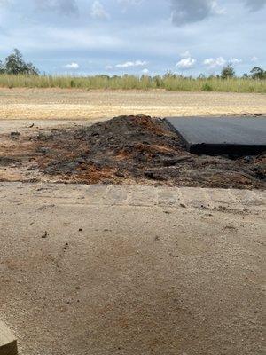 Dirt pile left over after pouring our back slab