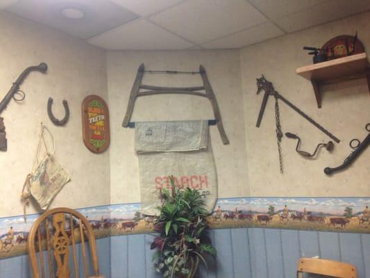 The decor is antique farm implements