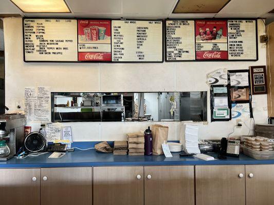 Menus behind the front counter - I uploaded legible pics of their paper menu too