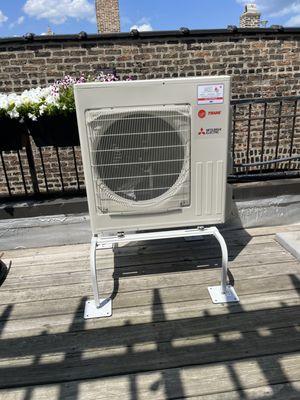 A single-zone Mitsubishi Mini-Split heat pump we installed this summer. This outdoor unit takes up less space than a traditional AC unit.