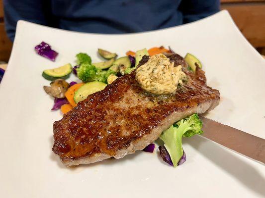 New York strip, compound butter, on steamed veggies.