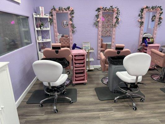 The work area. 4 salon chairs (pink!) with crystal accents