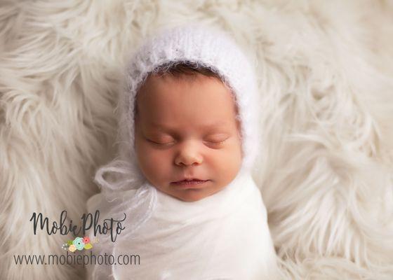 Newborn on white in Utah photo studio