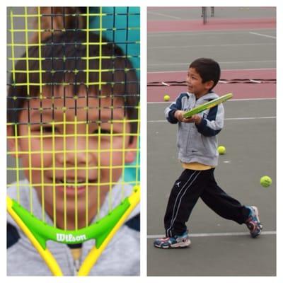 Excellent follow through, balance, and weight transfer on only his second day of playing tennis!