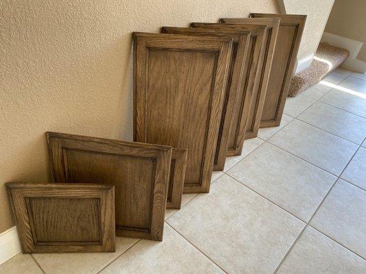 Cabinet Staining. Sanding down to remove coat and apply new stain and seal.