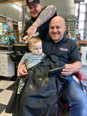 Kenny Ohman and his son Auston getting his first Barber Shop experience