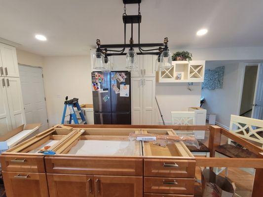 Kitchen remodeling took out the old lights and put in new modern ones.