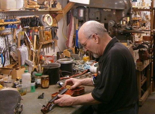 Mr. White at the workbench.