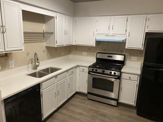 Kitchen with new granite top and stainless under out sink.