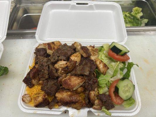 Lamb and chicken over rice and salad