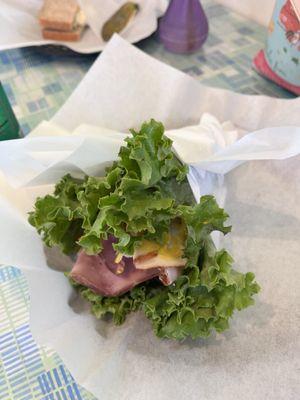 Lettuce wrapped turkey and ham sandwich