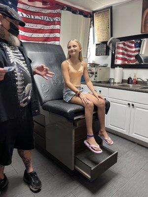 Waiting to get her helix pierced