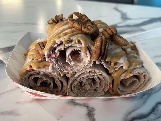 Rolled Ice Cream - Chocolate base, banana & strawberry mix-ins, and peanut butter & pecan toppings