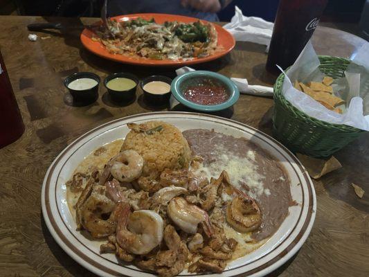 Shrimp and chicken, rice and refried beans