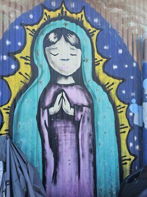 Drawing of   Virgin Mary on the wall.