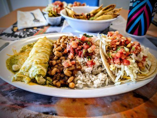 2 item plate: enchilada and taco with rice and beans