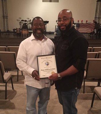 Courtney Benjamin receives certificate from Westland, MI Mayor